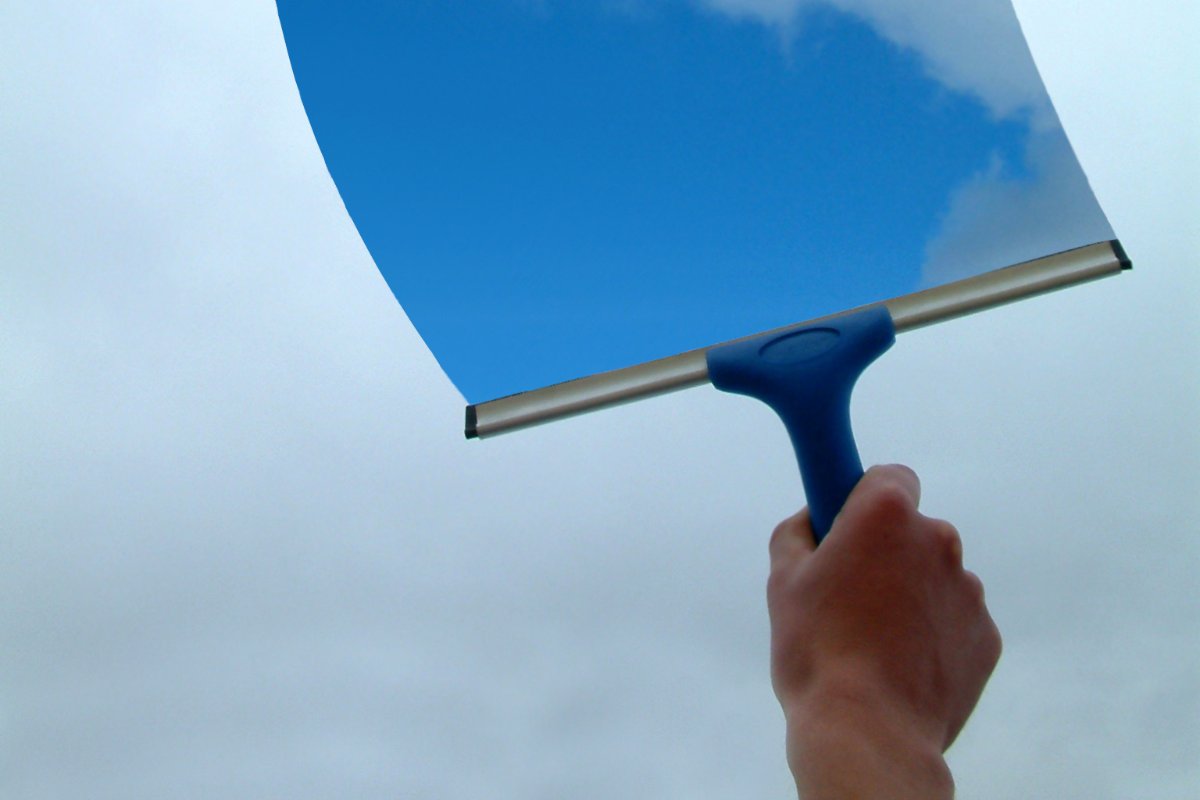 Squeegee cleaning a window pane